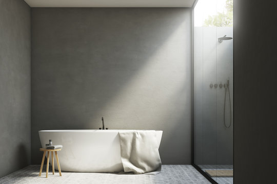 Gray bathroom with a tub