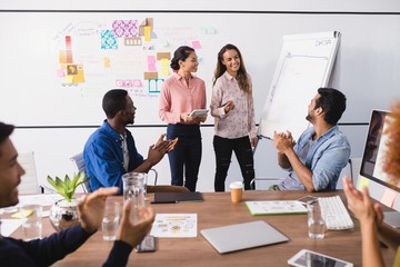 Happy business people working in office