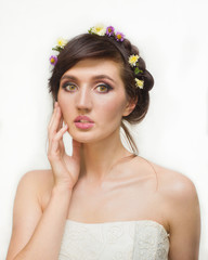Pretty young woman with Wreath of Pink Flowers