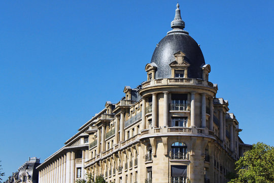 View on silver corner building wall with blue sky, paris city, france