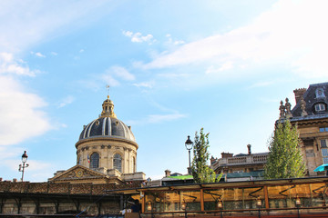 Fototapeta premium View on Institute of France building, blue sky with white clouds, paris city, france