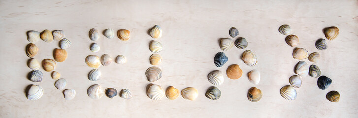The word RELAX written in sea shells