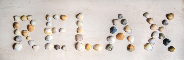 The word RELAX written in sea shells