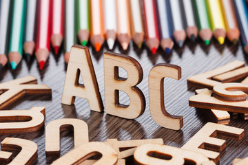 Back to school concept. Alphabet made of wooden letters
