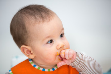 Baby laughing during lunch time. (6 months old).