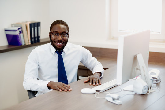 Young African American Man With Glasses In Office