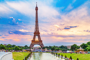 Eiffel tower, view from Trocadero park over fountain. People making their evening promenade around...