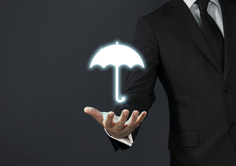 Businessman magical touch concept - umbrella
