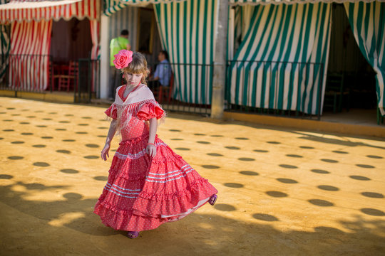 Little girls in flamenco style dress at the Sevilla, Spain. Seville's April Fair on April