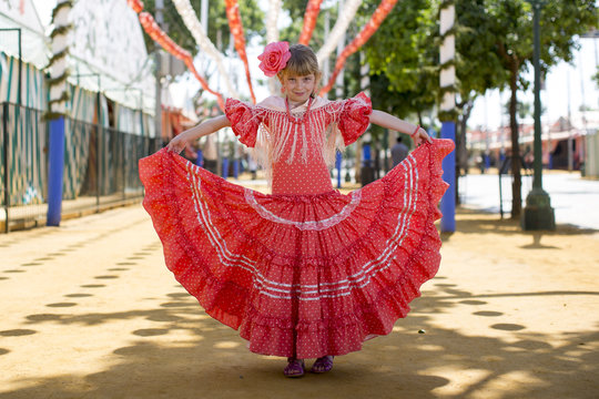 Little Girls In Flamenco Style Dress At The Sevilla, Spain. Seville's April Fair On April