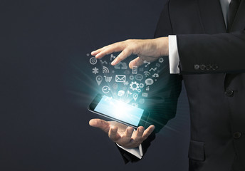 Businessman magical touch concept -  multimedia smart phone