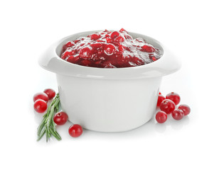 Delicious cranberry sauce in bowl on white background