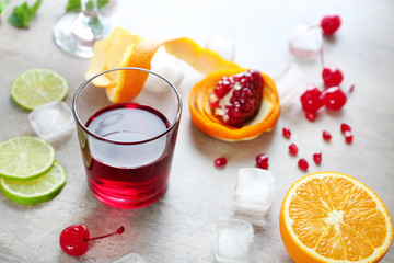 Ingredients for Tequila Sunrise cocktail on grey background