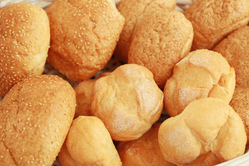 Different fresh bread loaves, closeup