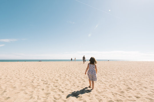 Girl walking on beach