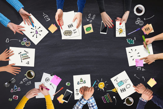 Business people group meeting at a blackboard table