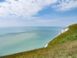 Lighthouse and cliffs at Beachy Head, UK.