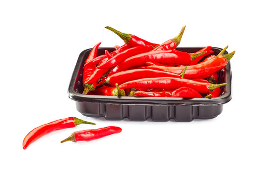 Heap of red chili peppers on retail tray