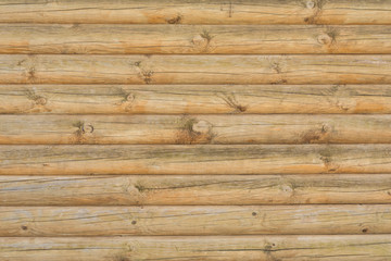 Fototapeta premium Texture of a ancient wall of wooden logs, abstract background