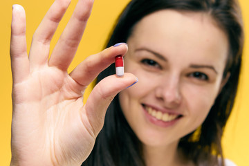 cheerful lady with a red white tablet