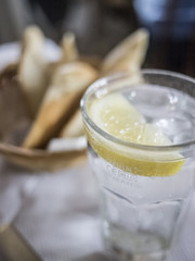 Fototapeta na wymiar Fizzy drink with ice and lemon.