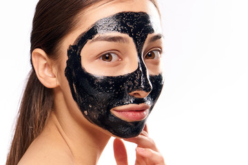 woman with black mask on face, cosmetic procedures