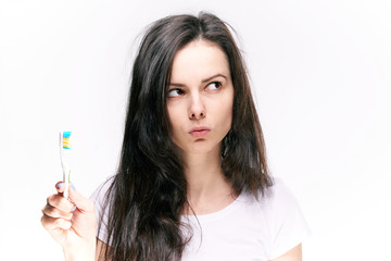 incredulous woman with a toothbrush