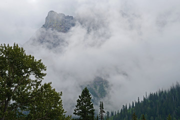 Fog covers the mountains of Glacier National Park.