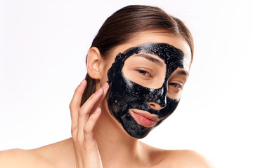 woman with a black mask on her face, tender skin