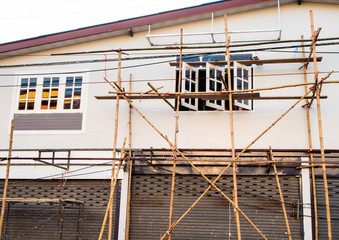 Scaffold made from bamboo of the house painted worker