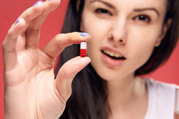 young woman taking pills