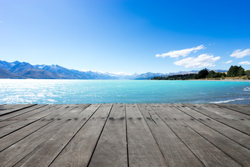 wooden floor with blue sea in blue sky
