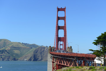 Naklejka premium Congested Traffic on The Golden Gate Bridge, an engineering marvel of construction and architectural landmark which sees both automobile and pedestrian traffic in San Francisco, California, USA