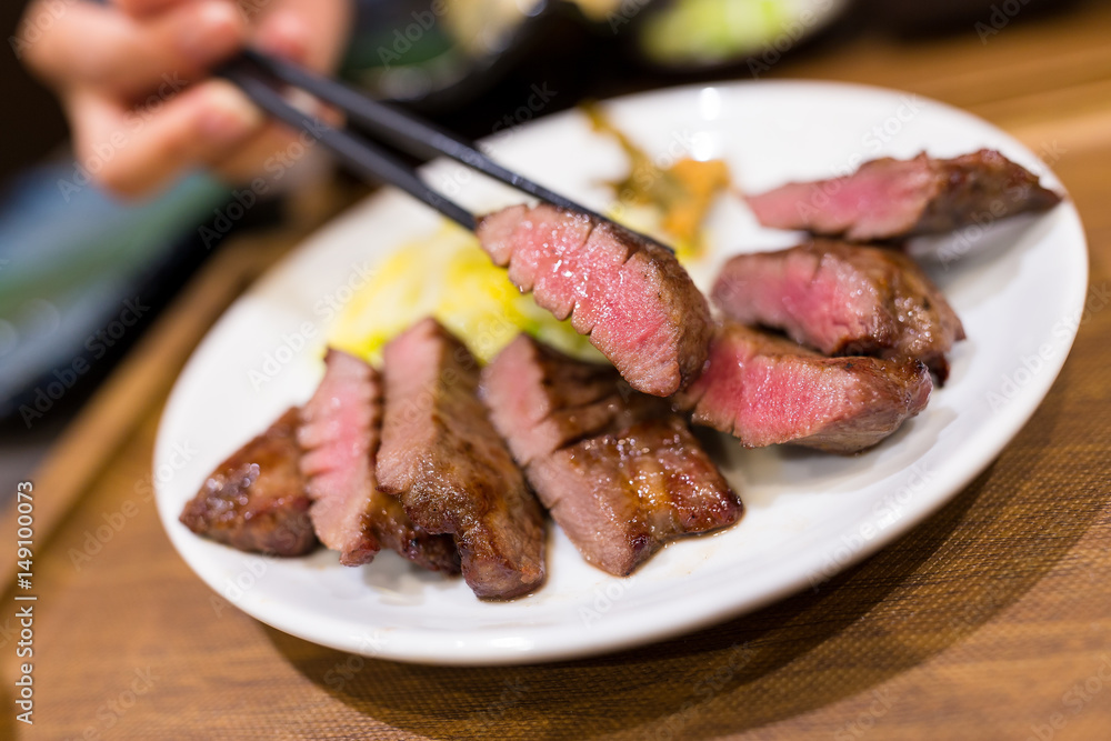 Wall mural Grilled beef in restaurant