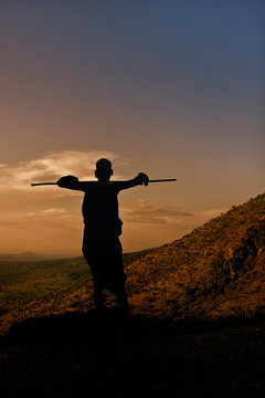 A Surmi man along side the road in the late afternoon, Omo Valley, Ethiopia