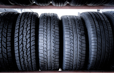 Car tires at warehouse in tire store, useful for background.