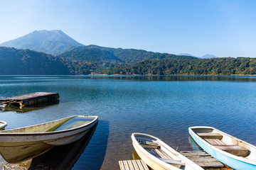 Fototapeta na wymiar Mount Kirishima and lake with boat