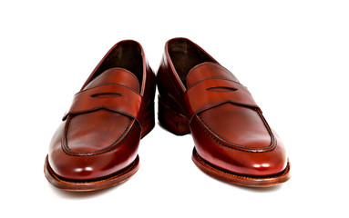 Pair of leather cherry calf penny loafer shoes together at angle
