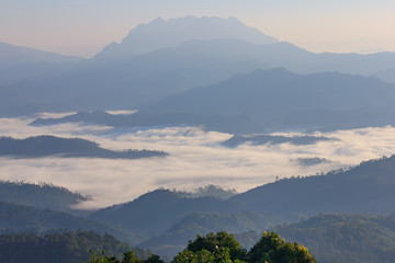 Morning Mist and Fog Moving Slowly From View Point in Sunrise Time at Doi Luang Chaing dao , High Mountain in Chiangmai , Thailand

