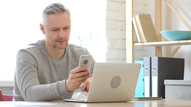Middle Aged Man Using Smartphone, Text Messaging