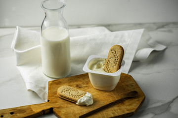 oatmeal cookies and milk on a old wooden background