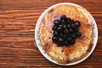 Delicious pancakes with cherry jam