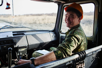 Fototapeta premium Portrait of a man, a firefighter, an Asian-Kazakh at work