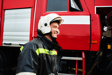 Fototapeta premium Portrait of a man, a firefighter, an Asian-Kazakh at work
