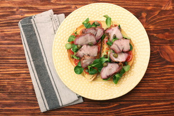 Open sandwich with pork greens and capers