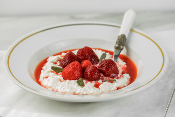 cottage cheese with strawberry sauce and fresh berries