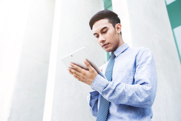Young Businessman in casual wear with digital tablet