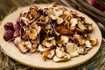 Bunch of dry apples on wooden table Dried apples on a wooden