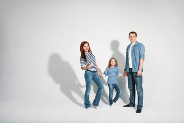 Happy family portrait standing on white background isolated