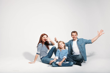 Naklejka premium Happy family portrait sitting on white background isolated